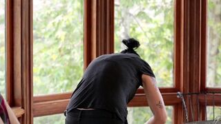 Vietnamese beauty fucks her boyfriend in the kitchen with a strap-on