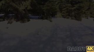 A hot chick is having fun on a sled by the fireplace