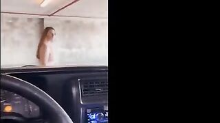 The sexy girl is flashing in the garage and has sex with a guy