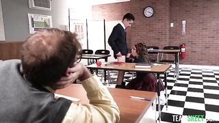 The student is having fun with his teacher and classmate on the table