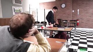 The student is having fun with his teacher and classmate on the table
