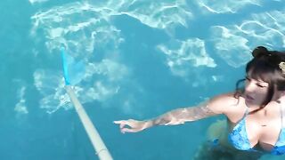 A girl with a tattoo was having fun by the pool, showcasing her wild side