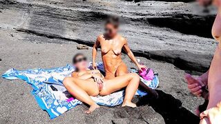 A girl removes her swimsuit and rubs herself while her friend jerks off