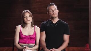 The man has complete power over the brunette, who is tied up