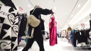 A risky blowjob in the fitting room, with a thrilling near-miss