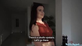A cute girl posed for a photographer in the studio for money